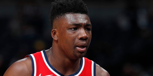 Washington Wizards center Thomas Bryant heads to the bench after drawing two quick fouls against the Denver Nuggets in the first half of an NBA basketball game Tuesday, Nov. 26, 2019, in Denver. (AP Photo/David Zalubowski)