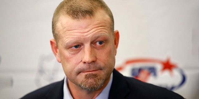 Former Boston Bruins goalie Tim Thomas speaks with members of the media before being inducted into the U.S. Hockey Hall of Fame, Thursday, Dec. 12, 2019, in Washington. (AP Photo/Patrick Semansky)