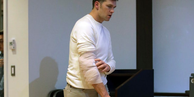 New England Patriots quarterback Tom Brady wears a wrap on his right elbow as he arrives to speak to the media following an NFL football game against the Kansas City Chiefs, Sunday, Dec. 8, 2019, in Foxborough, Mass. (AP Photo/Charles Krupa)