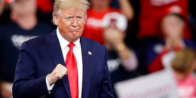 President Donald Trump gestures as he arrives at a campaign rally in Hershey, Pa., Tuesday, Dec. 10, 2019. (AP Photo/Matt Rourke)