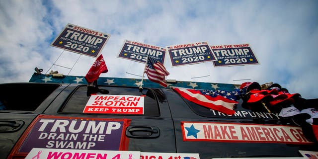 Trump supporters protest outside a town hall meeting where U.S. Rep. Elissa Slotkin (D-Mich.) is speaking on Monday, Dec. 16, 2019, in the Oakland Center at Oakland University in Rochester, Mich. (Jake May/The Flint Journal via AP)