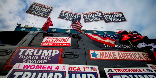 Trump supporters protest outside a town hall meeting where U.S. Rep. Elissa Slotkin (D-Mich.) is speaking on Monday, Dec. 16, 2019, in the Oakland Center at Oakland University in Rochester, Mich. (Jake May/The Flint Journal via AP)