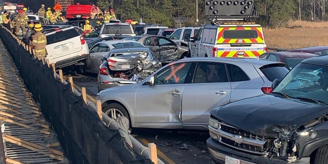 The congestion was so tight that some vehicles had been raised off the road by other cars that were pushed underneath their frames.