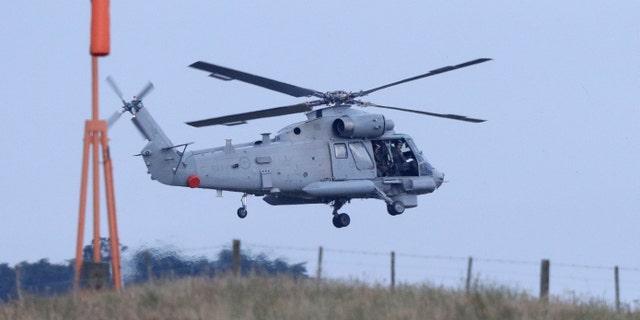 A New Zealand Navy helicopter takes off from Whakatane Airport as the mission to return victims of the White Island eruption begins in Whakatane, New Zealand, Friday, Dec. 13, 2019.