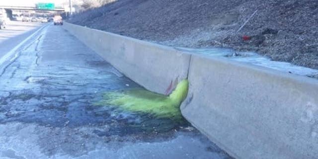 A mysterious greenish liquid that forced lane closures after it seeped onto a Michigan interstate on Friday allegedly came from a closed electroplating business whose owner is currently serving a year in federal prison for operating an unlicensed hazardous waste storage facility.