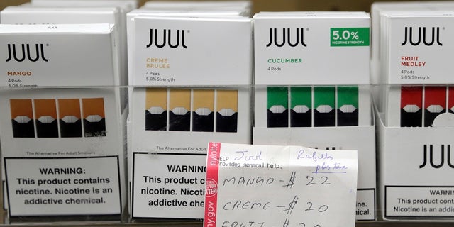 In this Dec. 20, 2018, file photo, Juul products are displayed at a smoke shop in New York.