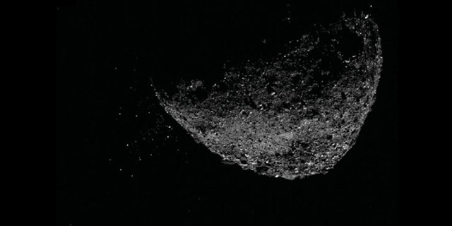 This view of asteroid Bennu ejecting particles from its surface on Jan. 6, 2019, was created by combining two images taken by the NavCam 1 imager aboard NASA's OSIRIS-REx spacecraft: a short exposure image, which shows the asteroid clearly, and a long-exposure image (five seconds), which shows the particles clearly. (Credit: NASA/Goddard/University of Arizona/Lockheed Martin)