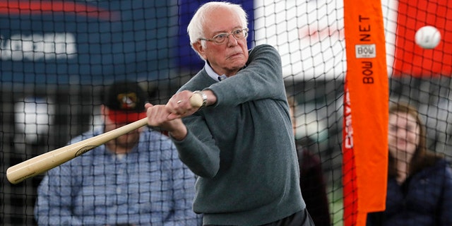 Democratic presidential candidate Sen. Bernie Sanders, I-Vt., hits in the batting cage during a meeting with minor league baseball players and officials at FunCity Turf, Sunday, Dec. 15, 2019, in Burlington, Iowa. (AP Photo/Charlie Neibergall)