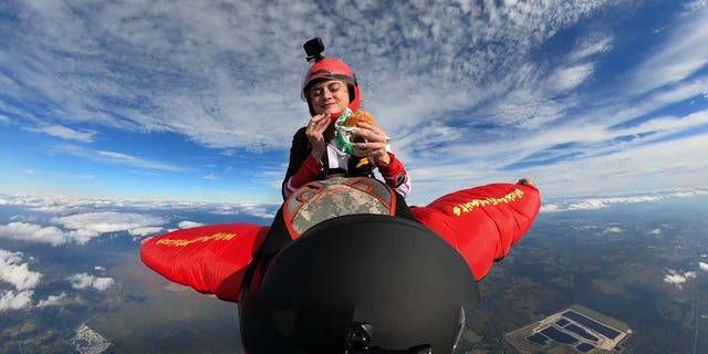 McKenna Knipe, 24, was filmed testing the Burger King Impossible Whopper using a GoPro while she was skydiving.