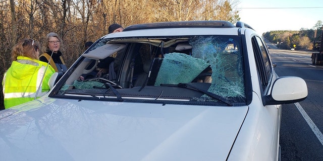 A deer that ran out of the woods and ran into a woman's vehicle Thursday morning in Jones County, Ga., shattered the front windshield.