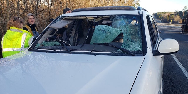 A deer that ran out of the woods and ran into a woman's vehicle Thursday morning in Jones County, Ga., shattered the front windshield.