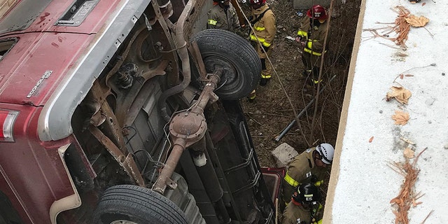 The vehicle fell about 25 feet after it was driven off the top of the parking deck.