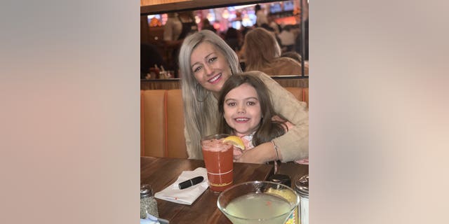 Jennifer Bell, 28, with daughter Georgia, eight. Terminally ill mother Jennifer Bell, 28, who was diagnosed with motor neuron disease in March, says she feels blessed to be able to spend Christmas with her children -- despite knowing it may be her last.