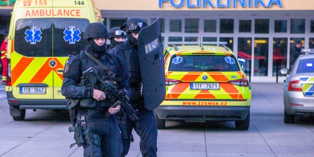 Police personnel outside the Ostrava Teaching Hospital after a shooting incident in Ostrava, Czech Republic, Tuesday, Dec. 10, 2019.