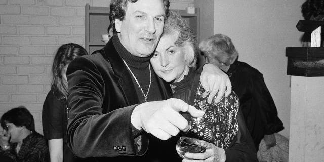 In this April 28, 1981 file photo, Actor Danny Aiello hugs actress Beatrice Arthur at a party following their opening performance in Woody Allen's play, "The Floating Lightbulb," in New York.