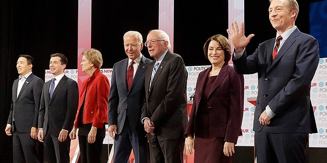 Democratic presidential candidates from left, entrepreneur Andrew Yang, South Bend Mayor Pete Buttigieg, Sen. Elizabeth Warren, D-Mass., former Vice President Joe Biden, Sen. Bernie Sanders, I-Vt., Sen. Amy Klobuchar, D-Minn., and businessman Tom Steyer stand on stage before a Democratic presidential primary debate Thursday, Dec. 19, 2019, in Los Angeles, Calif. (AP Photo/Chris Carlson)