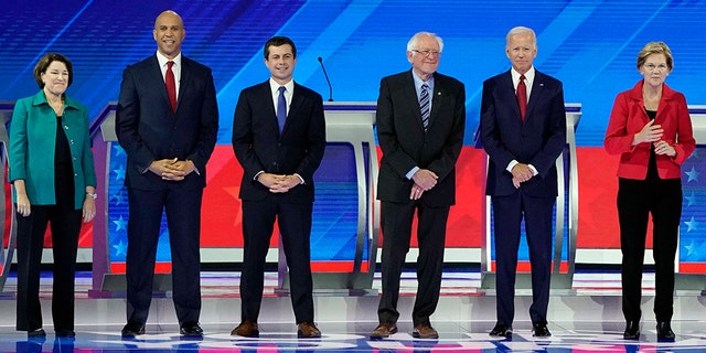 From left, Democratic presidential candidates Sen. Amy Klobuchar, D-Minn., Sen. Cory Booker, D-N.J., South Bend Mayor Pete Buttigieg, Sen. Bernie Sanders, I-Vt., former Vice President Joe Biden, Sen. Elizabeth Warren, D-Mass., Sen. Kamala Harris, D-Calif., entrepreneur Andrew Yang, former Texas Rep. Beto O'Rourke and former Housing Secretary Julian Castro are introduced Thursday, Sept. 12, 2019, before a Democratic presidential primary debate hosted by ABC at Texas Southern University in Houston. (AP Photo/David J. Phillip)