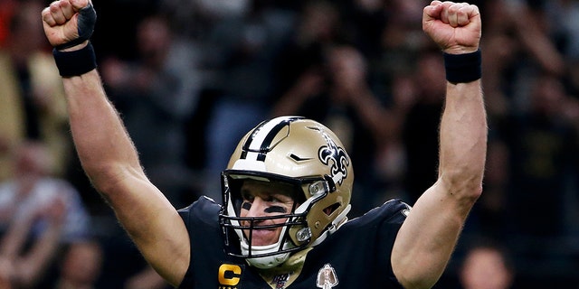 New Orleans Saints quarterback Drew Brees (9) celebrates his touchdown pass to tight end Josh Hill, which broke the NFL record for career touchdown passes, surpassing Peyton Manning, in the second half of an NFL football game against the Indianapolis Colts in New Orleans, Monday, Dec. 16, 2019. (AP Photo/Butch Dill)