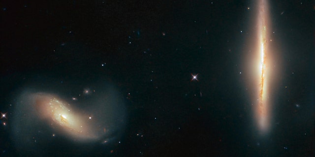 Some galaxies are closer friends than others. While many live their own solitary lives, others stray a little too close to a near neighbor and take their relationship to the next level. The galaxy in this picture, NGC 6286, has done just that, and is shown here with its partner, NGC 6285. (ESA/Hubble & NASA, K. Larson et al.)