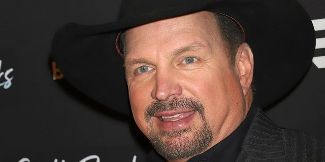 Garth Brooks is rethinking if he'll continue his ongoing stadium tour in light of spiking coronavirus cases.