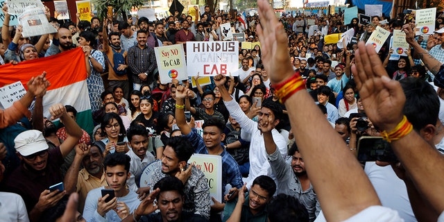 Indians protest against a new citizenship law in Mumbai, India, Monday, Dec. 16, 2019. The new law gives citizenship to non-Muslims who entered India illegally to flee religious persecution in several neighboring countries.