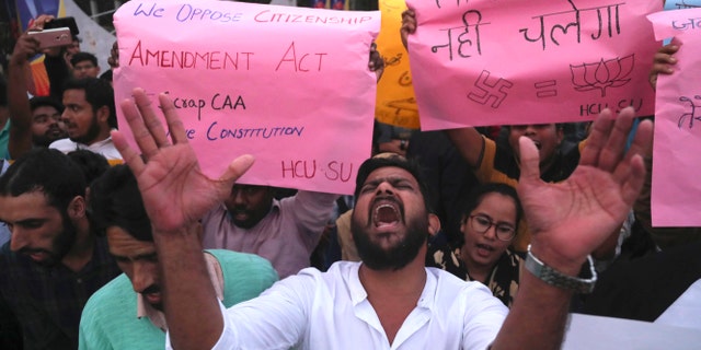 Indian Hyderabad Central University (HCU) students shout slogans during a protest rally against a new citizenship law in Hyderabad, India, Monday, Dec.16, 2019. The new law gives citizenship to non-Muslims who entered India illegally to flee religious persecution in several neighboring countries. (AP Photo/Mahesh Kumar A.)