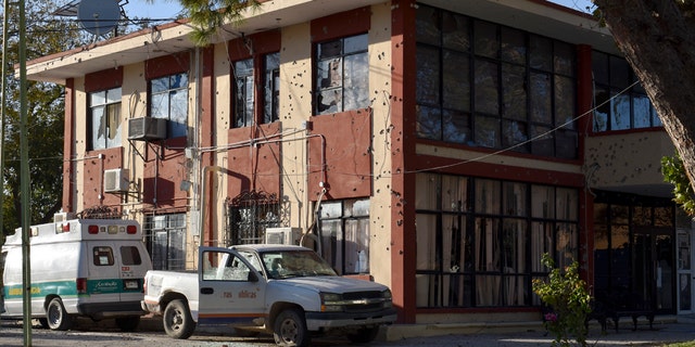 The City Hall of Villa Union is riddled with bullet holes after a gun battle between Mexican security forces and suspected cartel gunmen, Saturday, Nov. 30, 2019.
