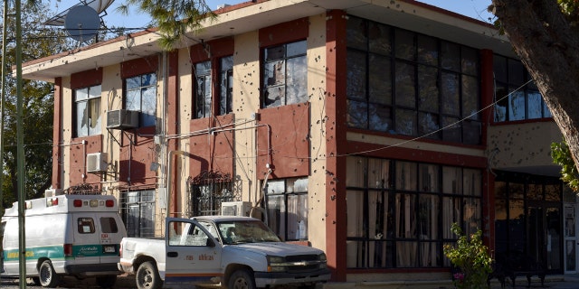 The City Hall of Villa Union is riddled with bullet holes after a gun battle between Mexican security forces and suspected cartel gunmen, Saturday, Nov. 30, 2019.