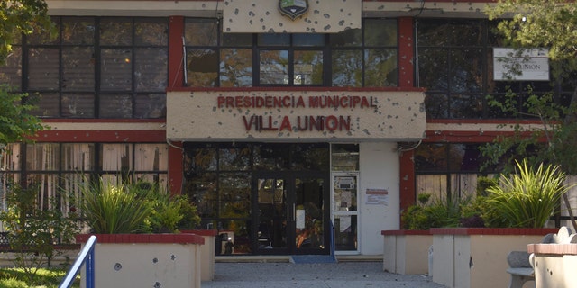 The City Hall of Villa Union is riddled with bullet holes after a gun battle between Mexican security forces and suspected cartel gunmen, Saturday, Nov. 30, 2019.