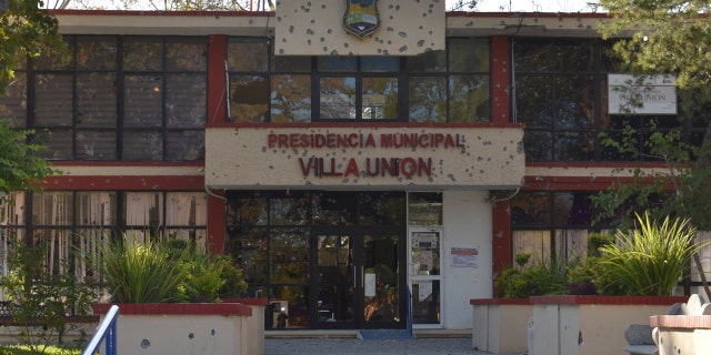 The City Hall of Villa Union is riddled with bullet holes after a gun battle between Mexican security forces and suspected cartel gunmen, Saturday, Nov. 30, 2019.