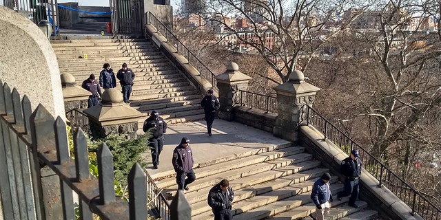 Investigators from the New York City Police Department on Thursday inspect a crime scene where an 18-year-old college student was stabbed to death Wednesday night.
