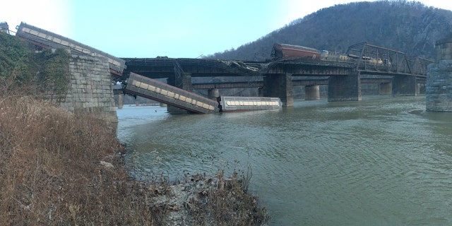 A CSX freight train derailed near Harpers Ferry, W. Va., sending two cars tumbling into the Potomac River.