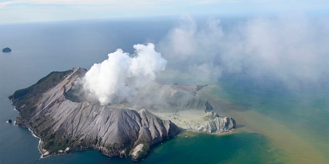 This aerial photo shows White Island after its volcanic eruption in New Zealand Monday, Dec. 9, 2019. (George Novak/New Zealand Herald via AP)