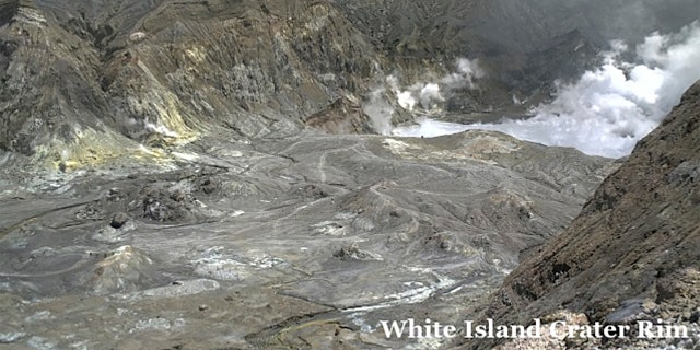 In this image released by GeoNet, tourists can be seen near the volcano's crater Monday, Dec. 9, 2019, on White Island, New Zealand.