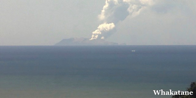 This image released by GNS Science, shows plumes of smoke from a volcanic eruption on White Island, seen from Whakatane, New Zealand Monday, Dec. 9, 2019.