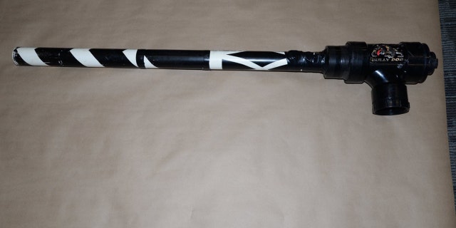 Police said the two suspects loaded drugs into the potato gun and shot them over the facility's fence.