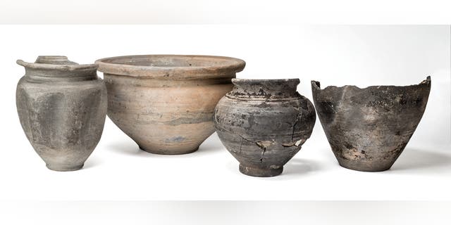 The remains of a Roman mirror and pots were also discovered. (Credit: SWNS)