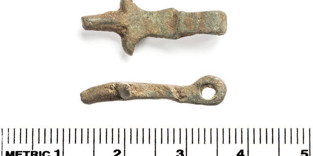 A belt buckle and a fragment of a horse harness were found, as well as evidence of a wooden bridge over the Thames. (Credit: SWNS)