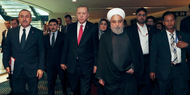 Turkey's President Recep Tayyip Erdogan, centre left, was among other world leaders present at the Islamic conference on Thursday. Erdogan and Rouhani had a meeting on the sidelines of the conference. (Presidential Press Service via AP, Pool)