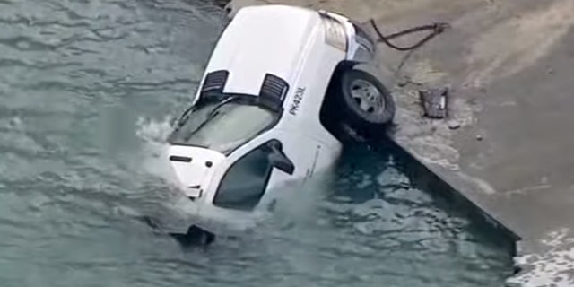 Two Chicago city workers escaped the icy waters of Lake Michigan on Wednesday, Dec. 11 2019, when they crawled out of the vehicle just before it slid into the water. (WLS-TV)