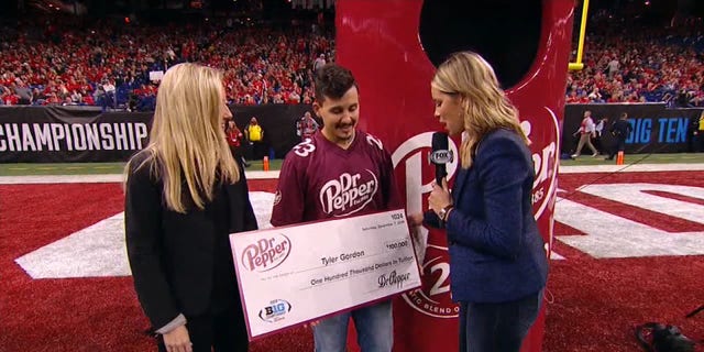 Tyler Gordon won the $100,000 scholarship from Dr. Pepper Saturday during the halftime of the Big Ten Championship.