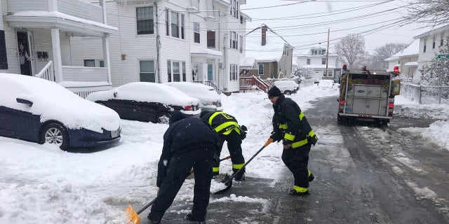 Firefighters helped shovel the man's driveway after freeing him from his snowblower.