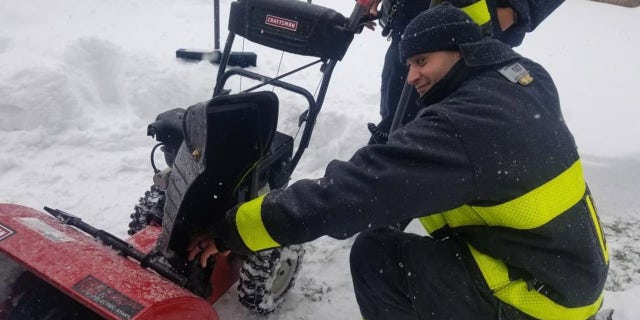 Fire officials had to rescue a man who got his hand stuck in a snowblower on Tuesday morning. The firefighters then helped put the man's snowblower back together.