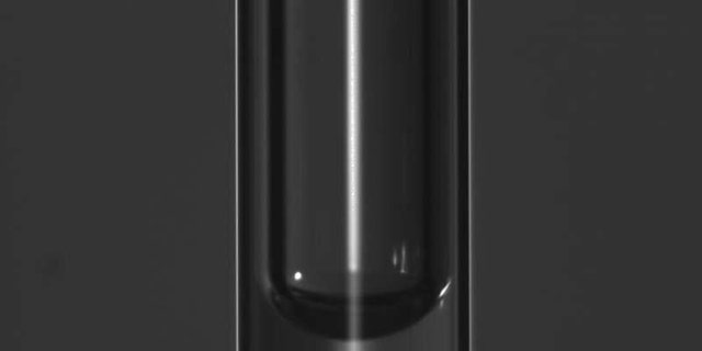 A student just solved the mystery of why bubbles appear stuck in thin vertical tubes. (Credit: EPFL)