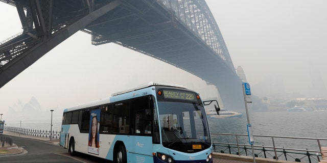 Thick smoke from wildfires shroud the Harbour Bridge in Sydney, Australia, Tuesday, Dec. 10, 2019.