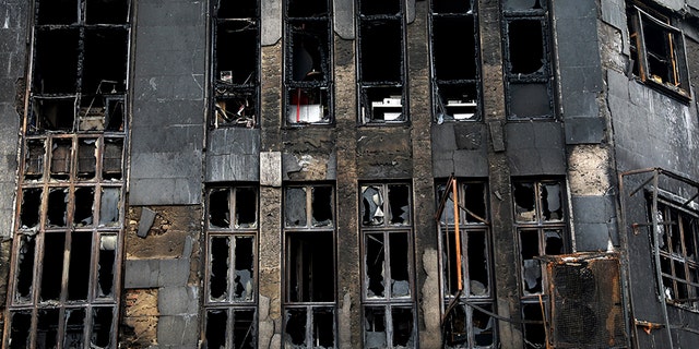 Shattered windows line a building that was set ablaze during protests over government-set gasoline prices rises, in Tehran, Iran, on Nov. 20. (AP)