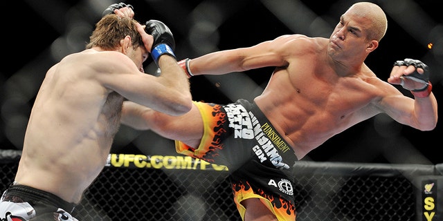 LAS VEGAS - NOVEMBER 21: Tito Ortiz (R) battles Forrest Griffin (L) during their Light Heavyweight Fight at the UFC 106 at Mandalay Bay Events Center on November 21, 2009 in Las Vegas, Nevada. (Photo by Jon Kopaloff/Getty Images)