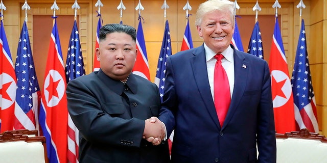 Trump and Kim shake hands during their 2019 meeting. (AP/KCNA)