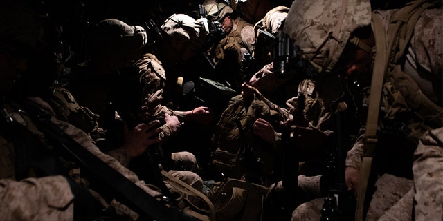 U.S. Marines assigned to Special Purpose Marine Air-Ground Task Force-Crisis Response-Central Command 19.2, prepare to deploy from Kuwait to the U.S. Embassy in Baghdad.