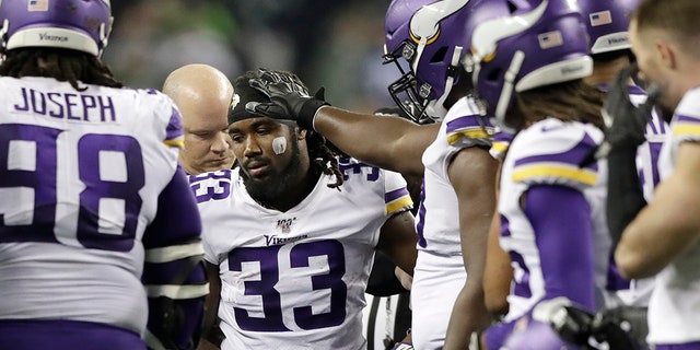 Minnesota Vikings's Dalvin Cook (33) heads off the field after being injured during the second half of an NFL football game against the Seattle Seahawks, Monday, Dec. 2, 2019, in Seattle. 